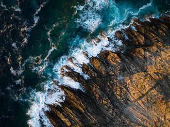 High angle view of rocks in sea