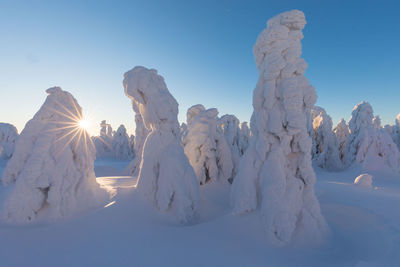 Panoramic view of snow covered mountain against sky