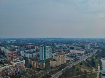 High angle view of buildings in city against sky