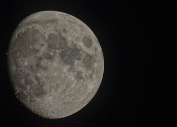 Low angle view of moon against sky at night