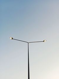 Low angle view of street light against clear sky