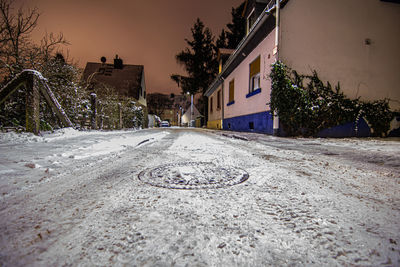 Surface level of road amidst buildings in city