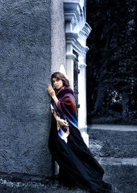 Portrait of young woman standing on street