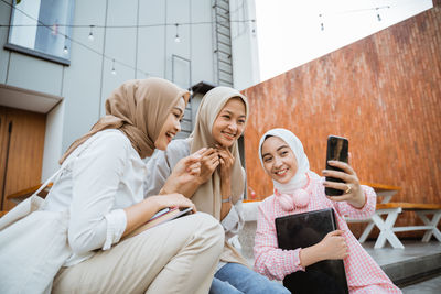 Portrait of woman using mobile phone