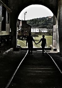 Man and woman standing in city