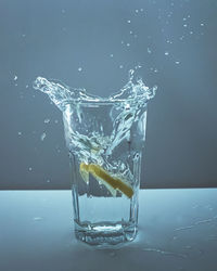 Close-up of water splashing on glass