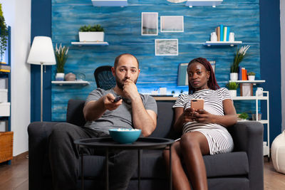 Couple watching movie at home