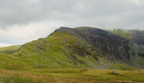 View at yr wyddfa - snowdon. highest mountain range in wales in clouds. snowdonia national park. uk.