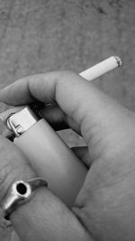 Human hand holding cigarette