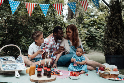 Group of people sitting on table