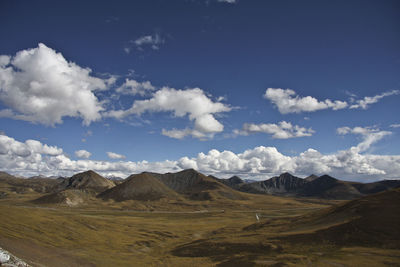 Scenic view of arid landscape against sky