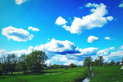 Scenic view of landscape against blue sky