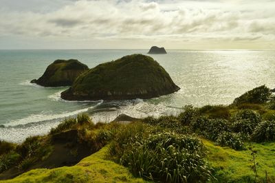 Scenic view of sea against cloudy sky