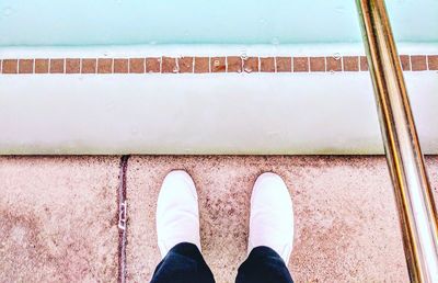 Low section of man standing on floor
