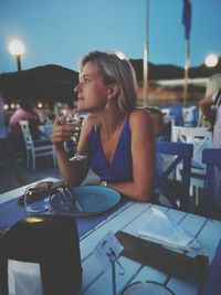 Young woman sitting at restaurant