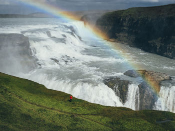 Scenic view of waterfall on mountain