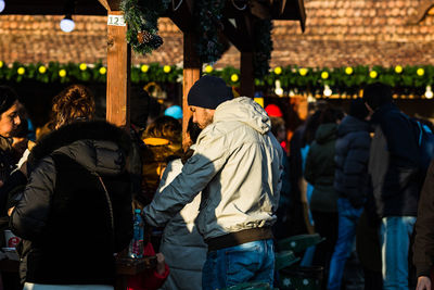 Rear view of people walking outdoors