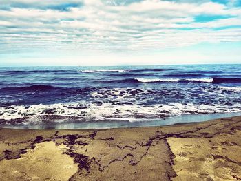 Scenic view of beach against sky