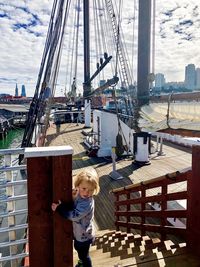 Full length of boy on sailboat