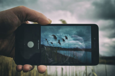 Man photographing using mobile camera