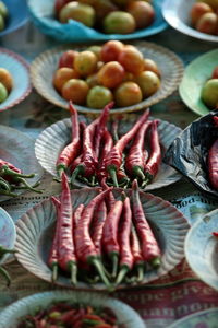 High angle view of chili peppers and tomatoes for sale at market