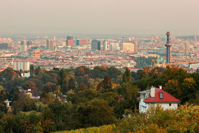 High angle view of townscape and trees against sky