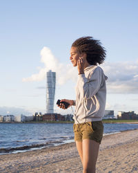 Young woman with mp3 player