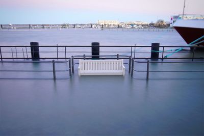 Scenic view of swimming pool by sea against sky