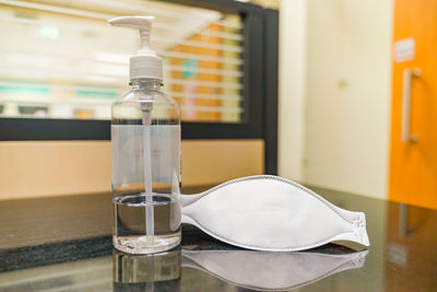 Close-up of water bottle on table at home