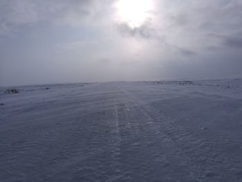 Scenic view of sea against sky during winter