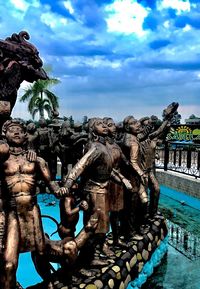 Low angle view of statue against cloudy sky