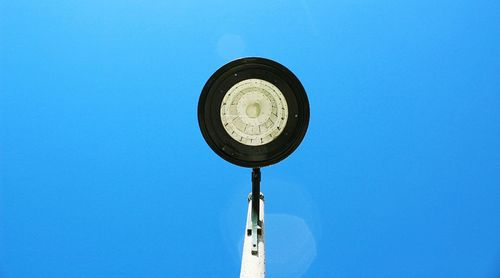 Low angle view of pole against clear blue sky