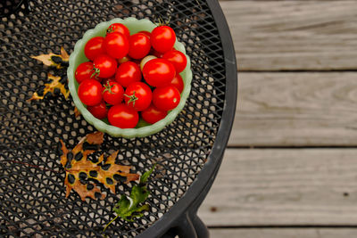 High angle view of tomatoes in basket on table