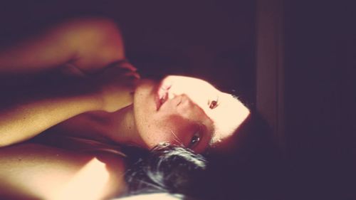 Woman sleeping on bed