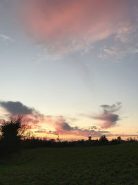 Scenic view of field against sky during sunset