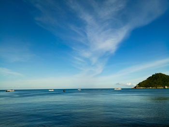 Scenic view of sea against blue sky