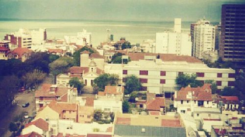 High angle view of cityscape by sea