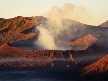 Smoke emitting from volcanic mountain