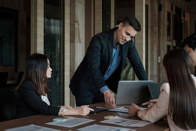 Business colleagues brainstorming at office