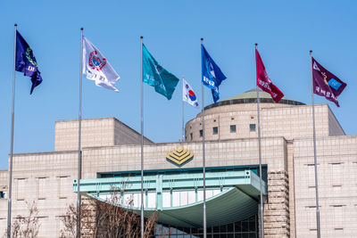 Low angle view of flag against sky