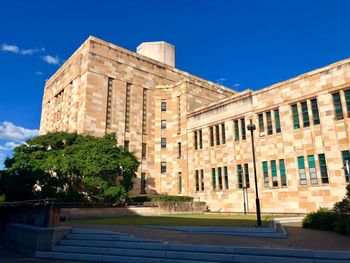 Low angle view of historical building against blue sky