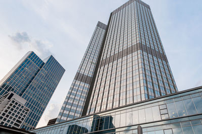 Low angle view of modern buildings against sky