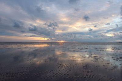 Scenic view of sea at sunset