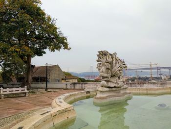 Statue of historic building against sky