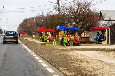 Cars on road against buildings