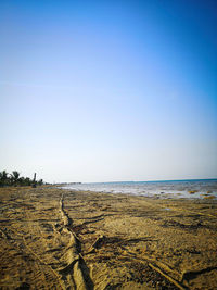 Scenic view of sea against clear blue sky