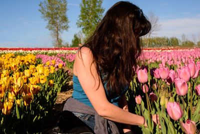 Woman by blooming tulips