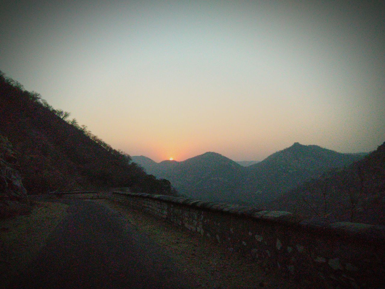 SCENIC VIEW OF MOUNTAINS AGAINST CLEAR SKY