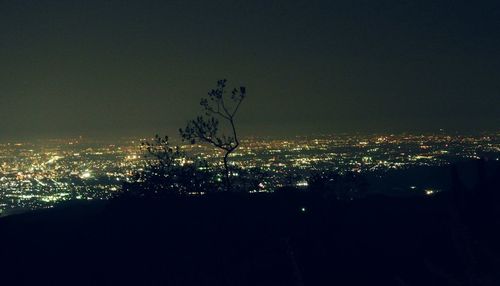 Illuminated cityscape at night