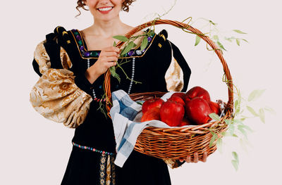 Portrait of woman holding christmas tree